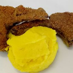 A picture of Abbacchio fritto lamb in a pepper and Parmesan crust.