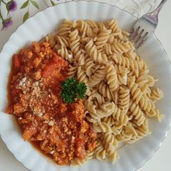 A picture of Minced turkey in rich roasted vegetable sauce.