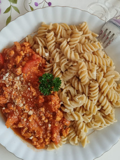 A picture of Minced turkey in rich roasted vegetable sauce.