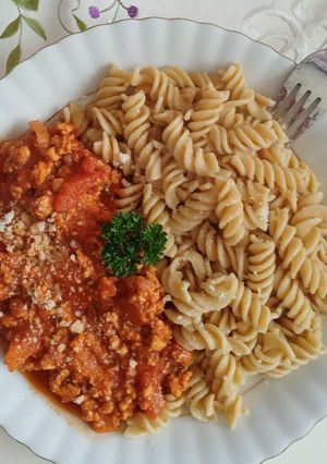 A picture of Minced turkey in rich roasted vegetable sauce.