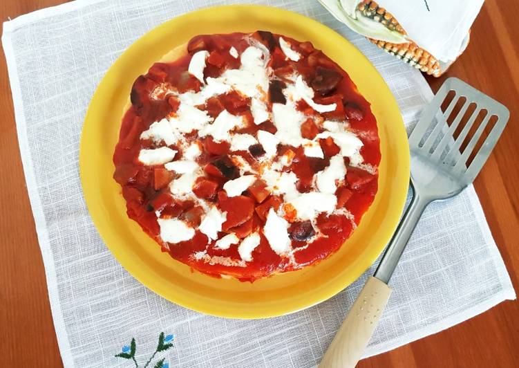 Pizza di polenta al sugo di funghi