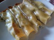 Una foto di cannelloni alla ricotta e spinaci