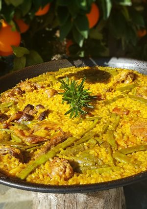 A picture of Valencian Paella with Chicken and Rabbit 🥘.