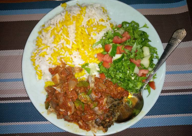 White rice,curried maca with fish stew and salad