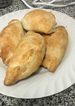 Una foto de Empanadas de cebolla y muzarella