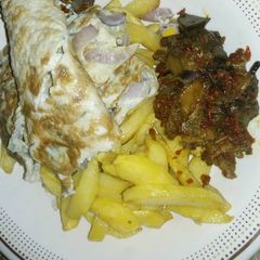 A picture of Chips, Egg and Assorted meat.