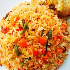 A picture of #Christmas #Lagos Colorful fried rice with roasted Chicken.
