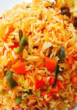 A picture of #Christmas #Lagos Colorful fried rice with roasted Chicken.