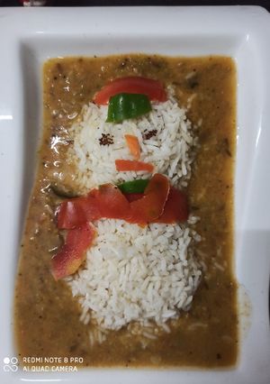 A picture of Sambar and Rice.