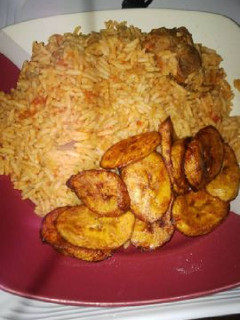 A picture of Jollof rice with fried plantain.