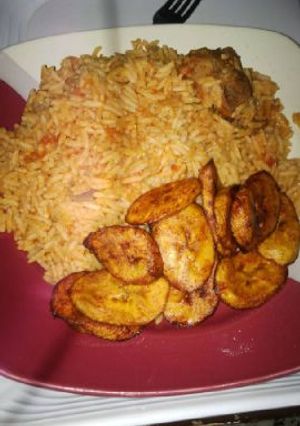 A picture of Jollof rice with fried plantain.