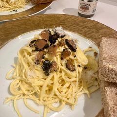 A picture of Tagliolini (pasta) with Taleggio cheese and black truffle.