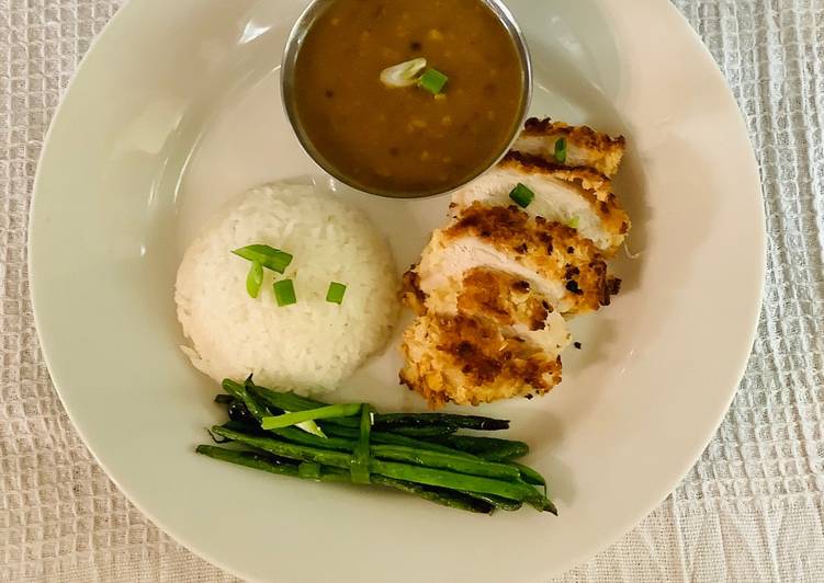 Chicken katsu served with jasmine sticky rice, curry sauce and green beans.π