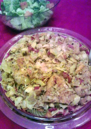 A picture of Chicken & Artichokes over pasta.