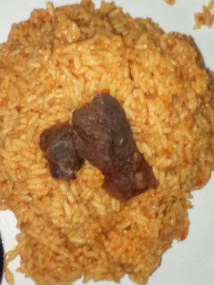 A picture of Jollof rice and meat #Ramadancontest#.