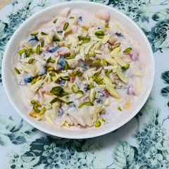 A picture of Mix fruits with strawberry yoghurt.