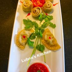 A picture of Veg and Cheesy Dumpling (Momos).