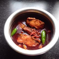 A picture of Rohu fish curry.