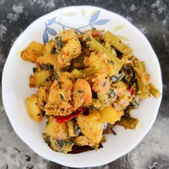 A picture of Pumpkin sabji with malabar spinach and prawn.