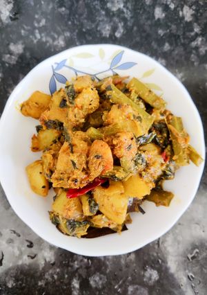 A picture of Pumpkin sabji with malabar spinach and prawn.