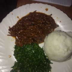 Omena stew with ugali and kales A picture of Omena stew with ugali and kales.