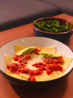 A picture of Cheats Pea and Ricotta Ravioli with Rich Tomato Sauce.