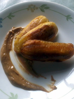 A picture of Crispy fried banana with peanut honey sauce.