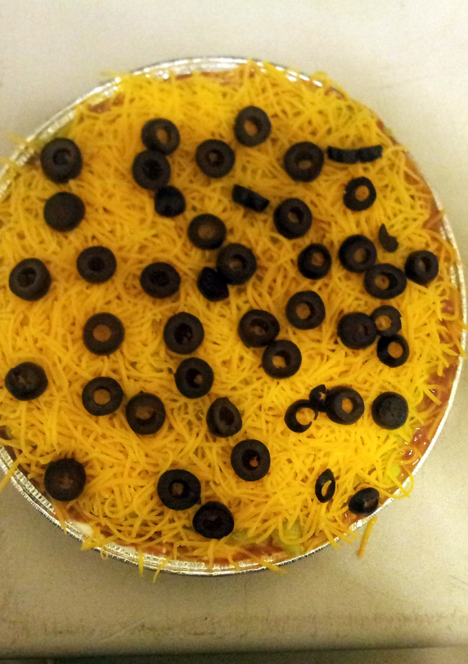 A picture of 7 layer taco dip.
