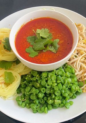 A picture of Rice vermicelli with Tuna Curry Sauce.