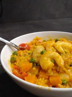 A picture of Colourful risotto with scampi.