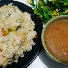 A picture of Egg fried rice with chicken corn soup 🍲 😋.