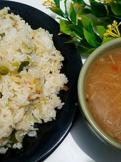 A picture of Egg fried rice with chicken corn soup 🍲 😋.