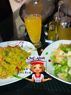 A picture of Fried Dambun cous cous with salad.