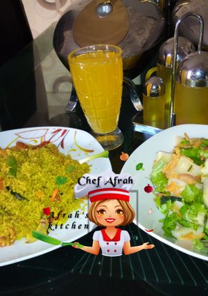 A picture of Fried Dambun cous cous with salad.