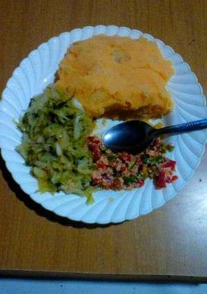 A picture of Mashed Potatoes,hot chilli cabbage and scrambled spanish omelet.