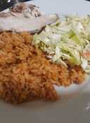 Jollof Rice and Chicken with Coleslaw - Travelandmunchies