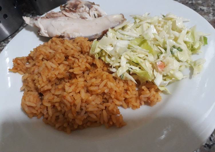 Jollof rice with coleslaw and chicken