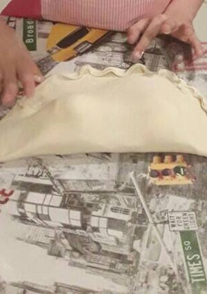 Una foto de Empanada gigante de jamón y queso