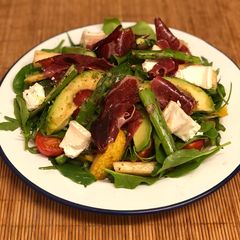 A picture of Jamon iberico, asparagus, pear and goats cheese salad.