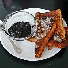 A picture of My Bluberry Homemade Jam on Toasted Brown Bread Breakfast 🤩😍.