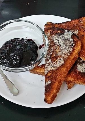 A picture of My Bluberry Homemade Jam on Toasted Brown Bread Breakfast 🤩😍.