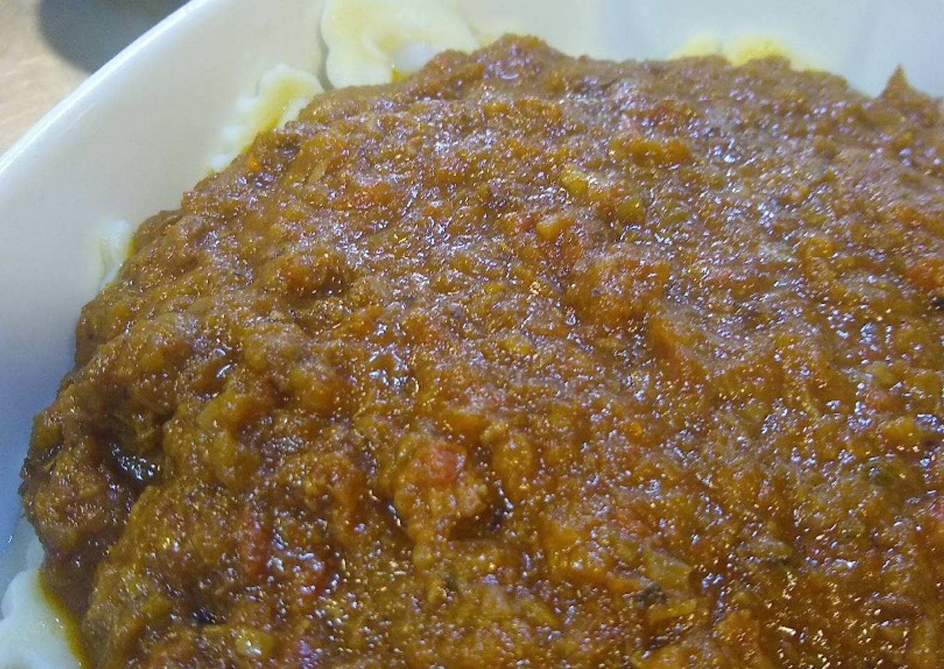 Ravioles con bolognesa