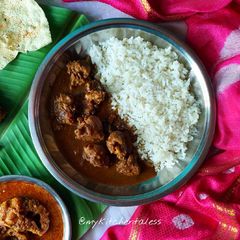 Steamed rice and desi chicken curry A picture of Steamed rice and desi chicken curry.
