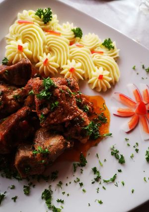 O poză a rețetei Carne de porc cu sos de roșii.