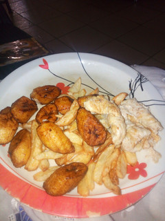 A picture of Chips,plantain and fried egg.