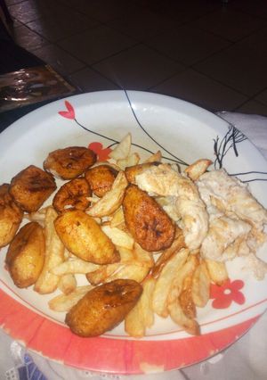 A picture of Chips,plantain and fried egg.
