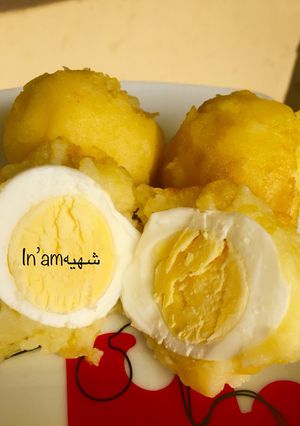 A picture of Egg in potatoes.