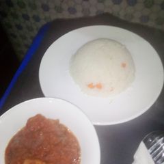 A picture of White rice and stew.