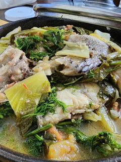 Hình của món Đầu xương cá rô phi om dưa.
