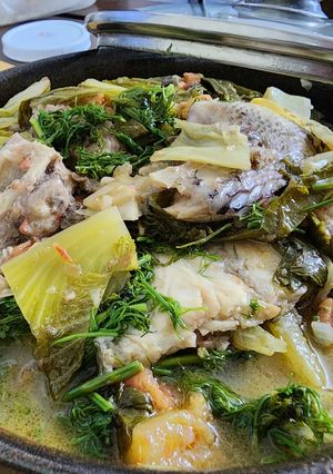 Hình của món Đầu xương cá rô phi om dưa.
